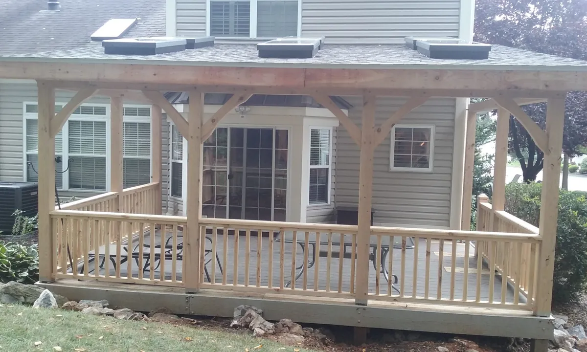 Covered wood porch addition on the back of a home