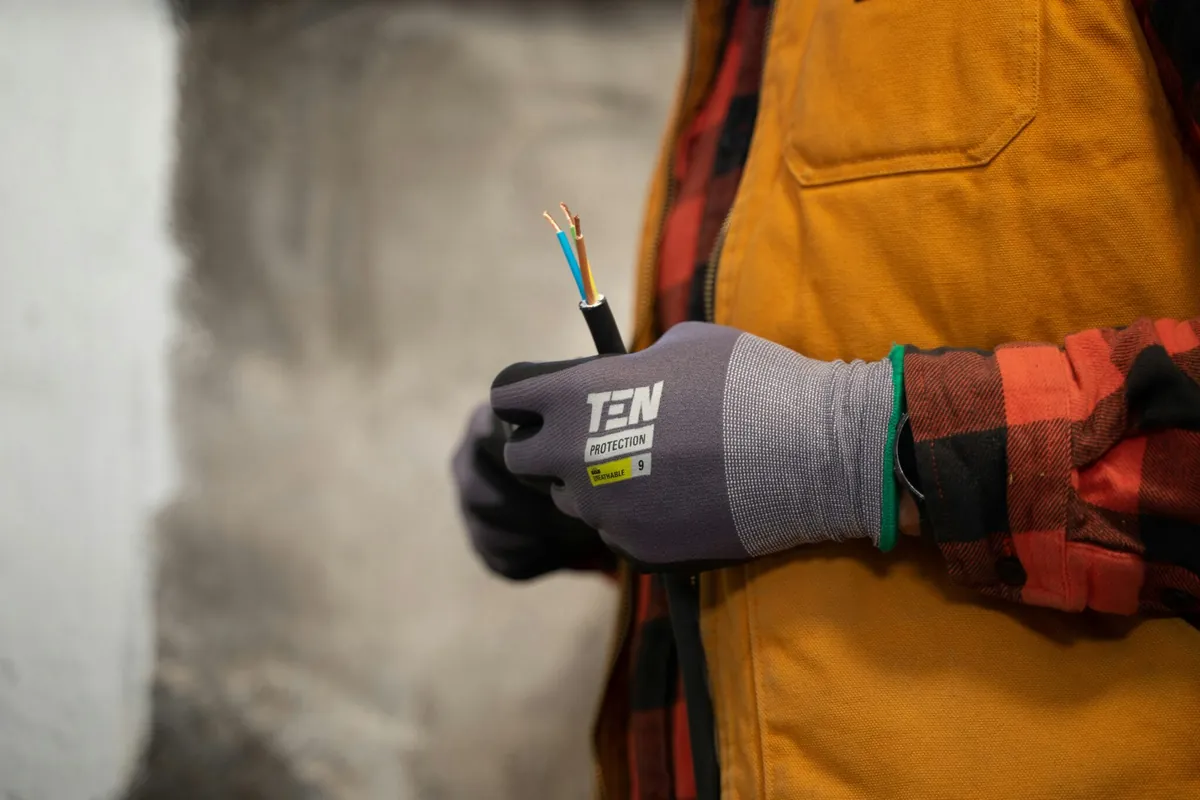 Electrician holding wires