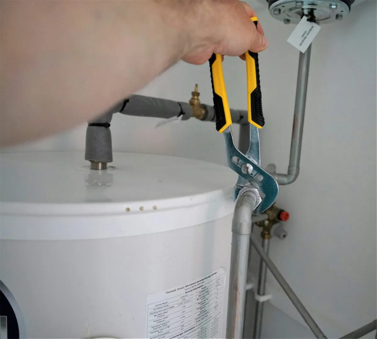 Plumber repairing a water heater
